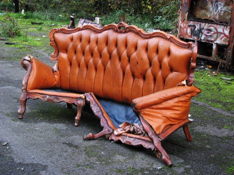 Company van parked in Bayswater next to a commercial bin