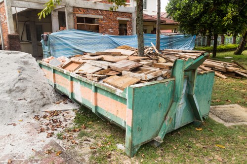 People disposing of furniture at Bayswater recycling center