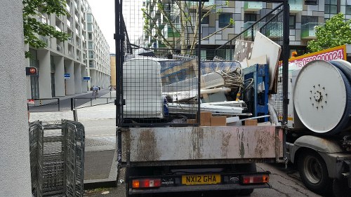 Detailed office clearance process with team members handling equipment